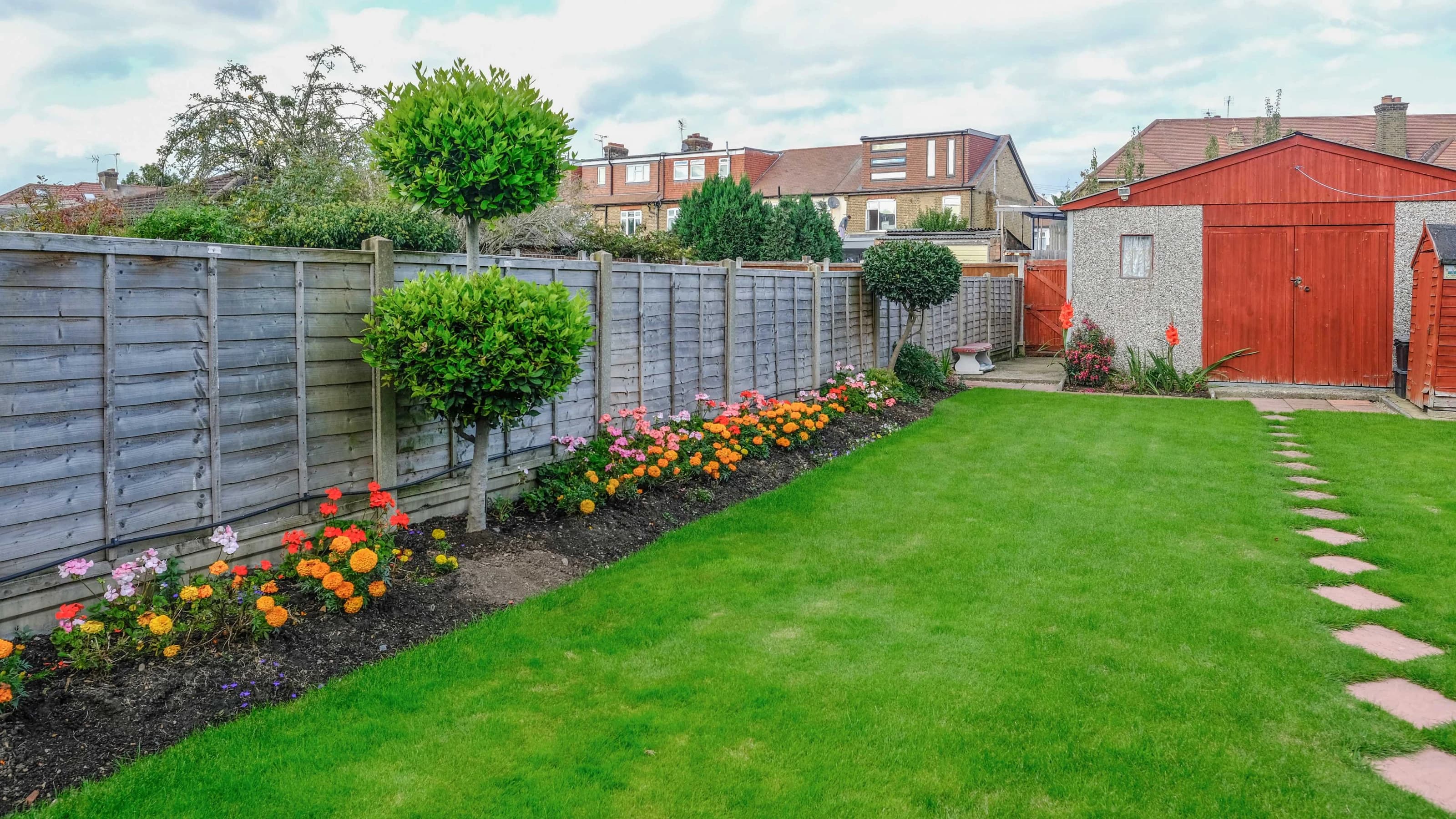 UK lawn bordered with flower beds 